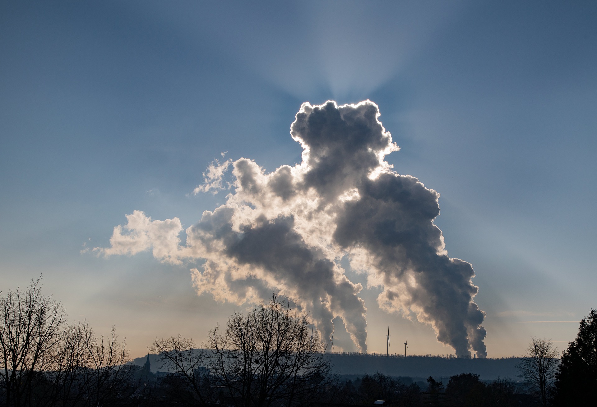 Smoke billowing from chimneys.