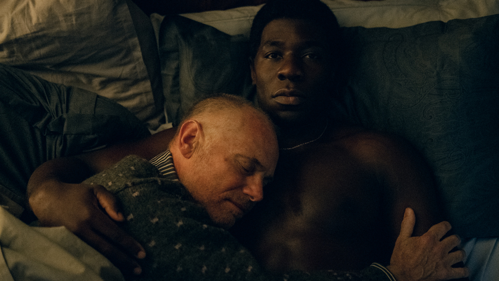 McKinley  Belcher III as Ladroit, cradling his partner William (Mark Gillis) who is suffering from Aids