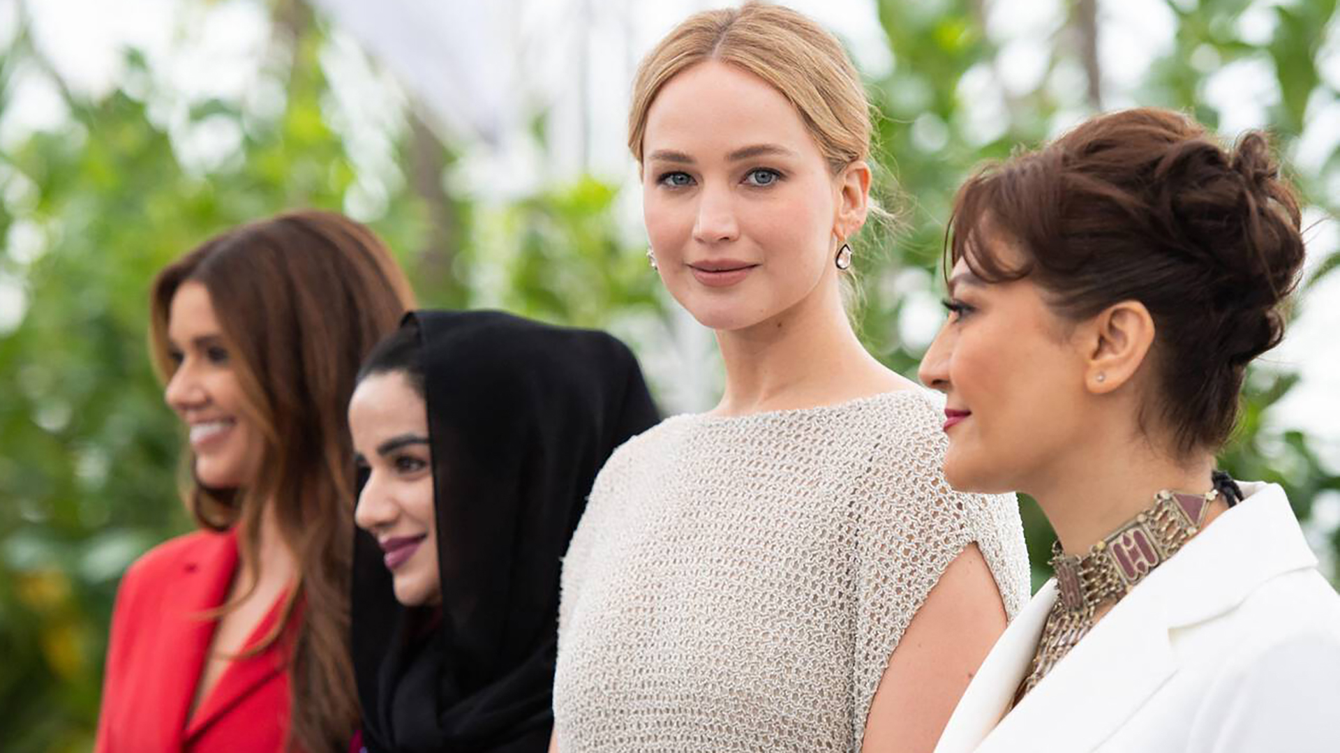 (L-r) Justine Ciarrocchi, dentist Zahra Mohammedi, Jennifer Lawrence and Bread & Roses director Sahra Mani