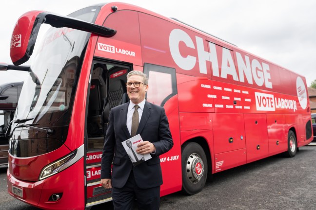Keir Starmer in front of Labour's campaign bus with the 'change' slogan written on the side
