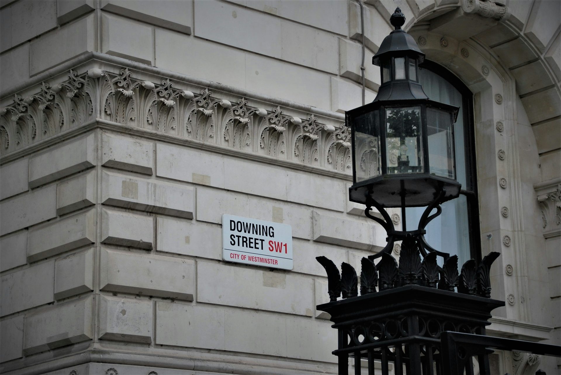 A street sign on a wall for Downing Street in London