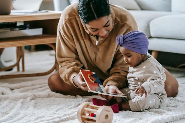 Mum and baby reading a book