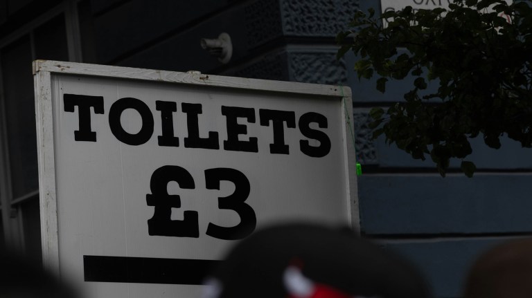 A sign advertising the use of public toilets for £3