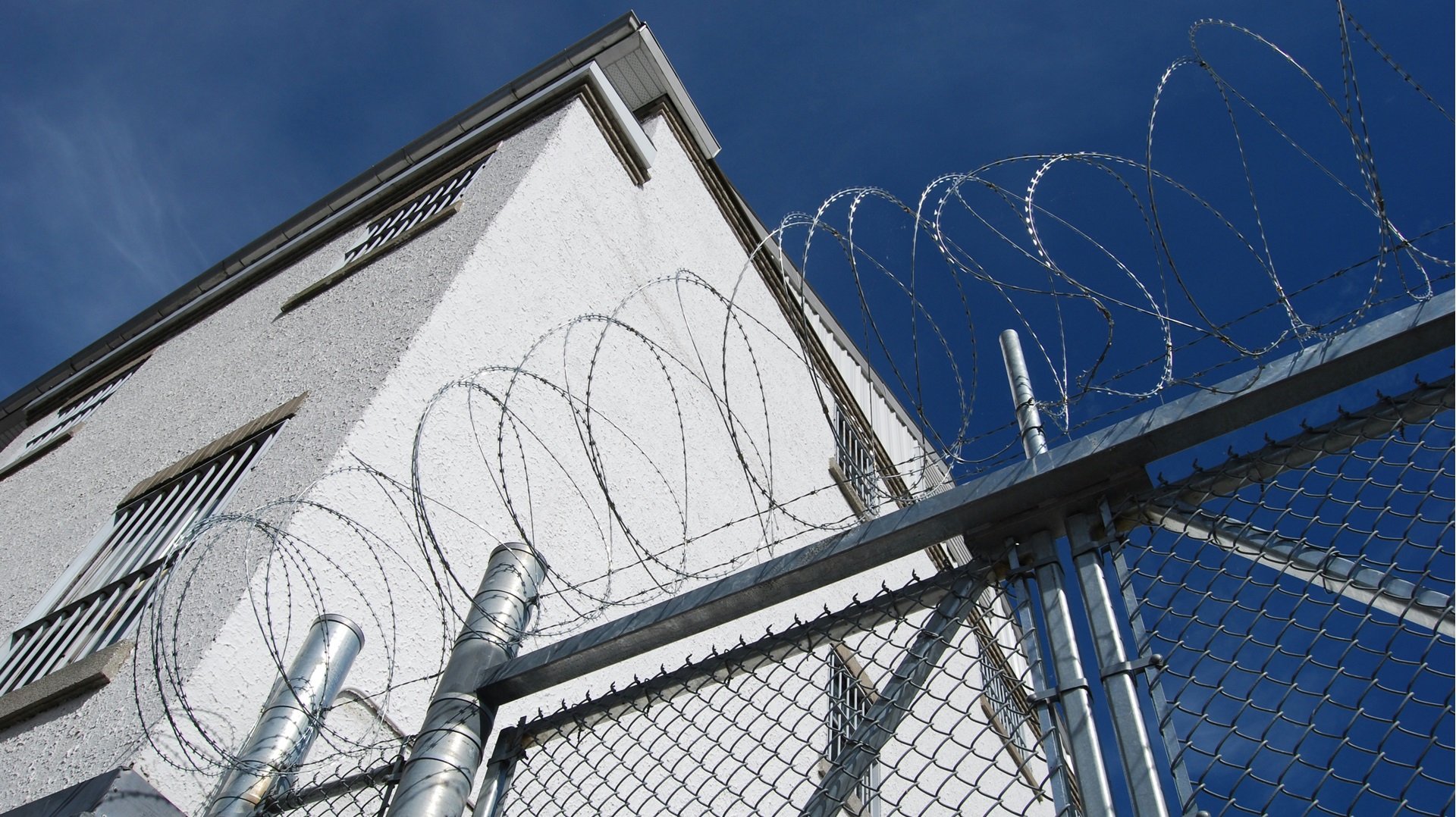 Barbed wire on a wall at a prison