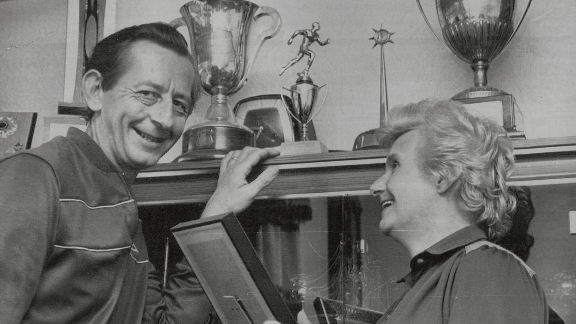 Steve Cram's parents Bill and Maria show off some of their son's trophies