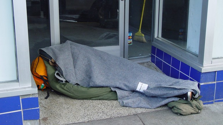 a person experiencing homelessness on the streets