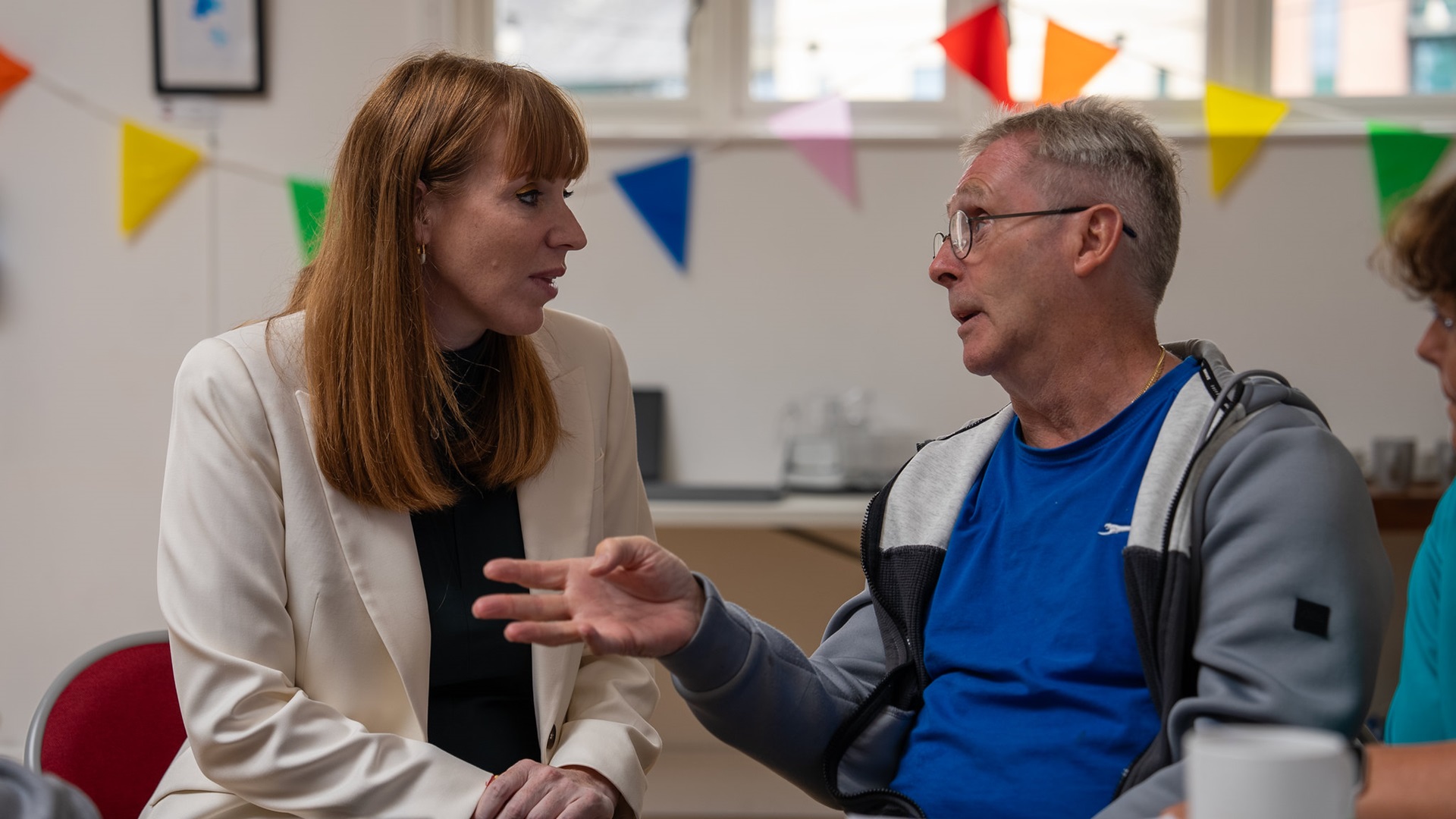 Labour deputy leader Angela Rayner speaking to a man at a homelessness charity in Wales