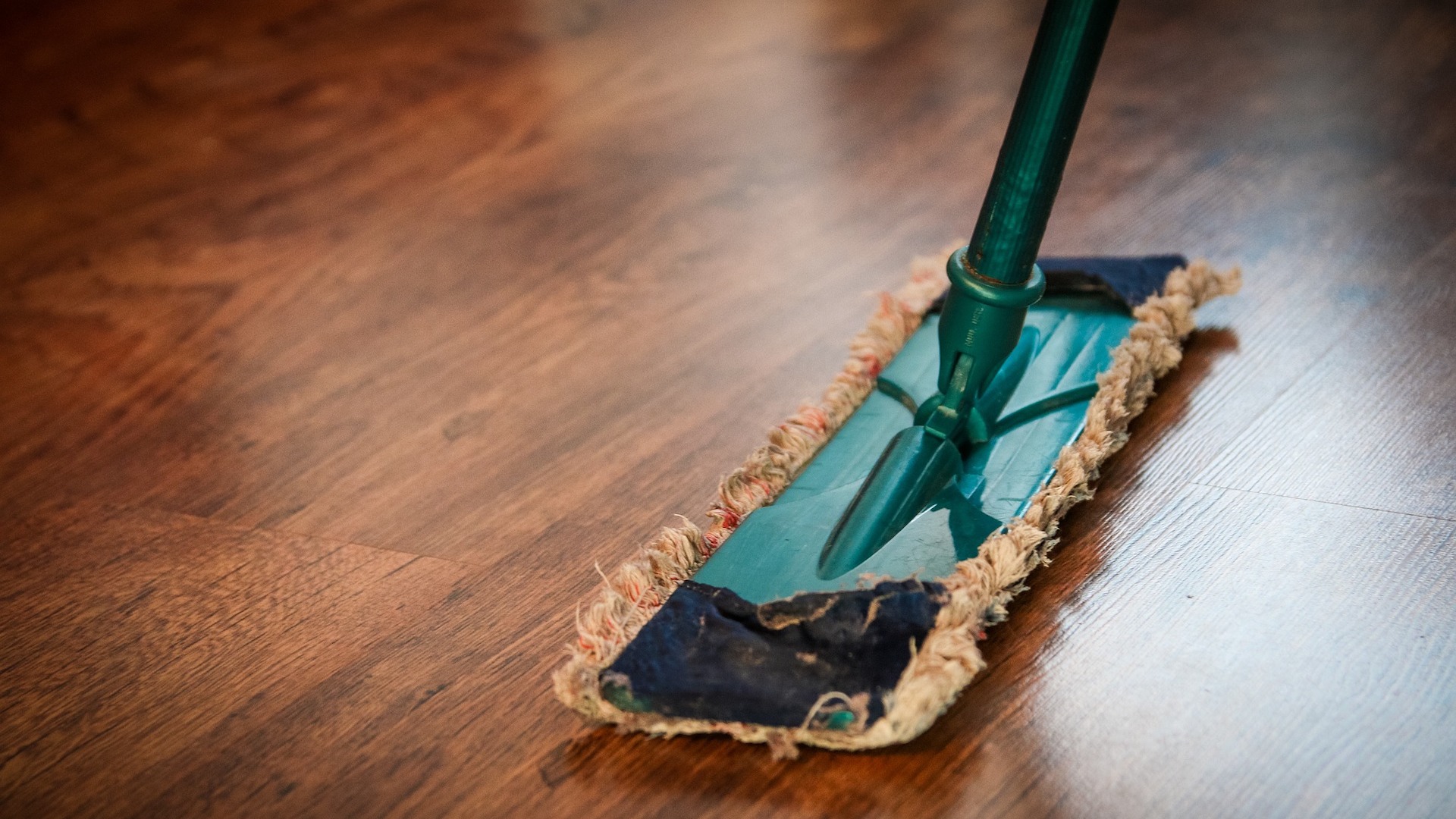 a mop on a wooden floor