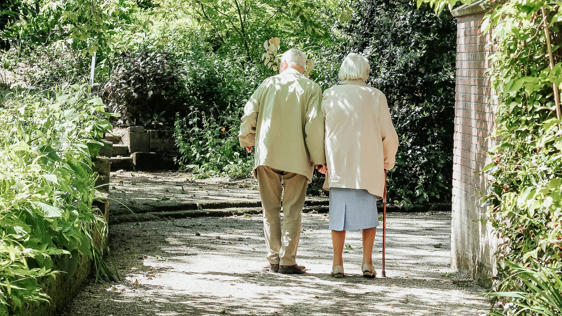 elderly couple walking together