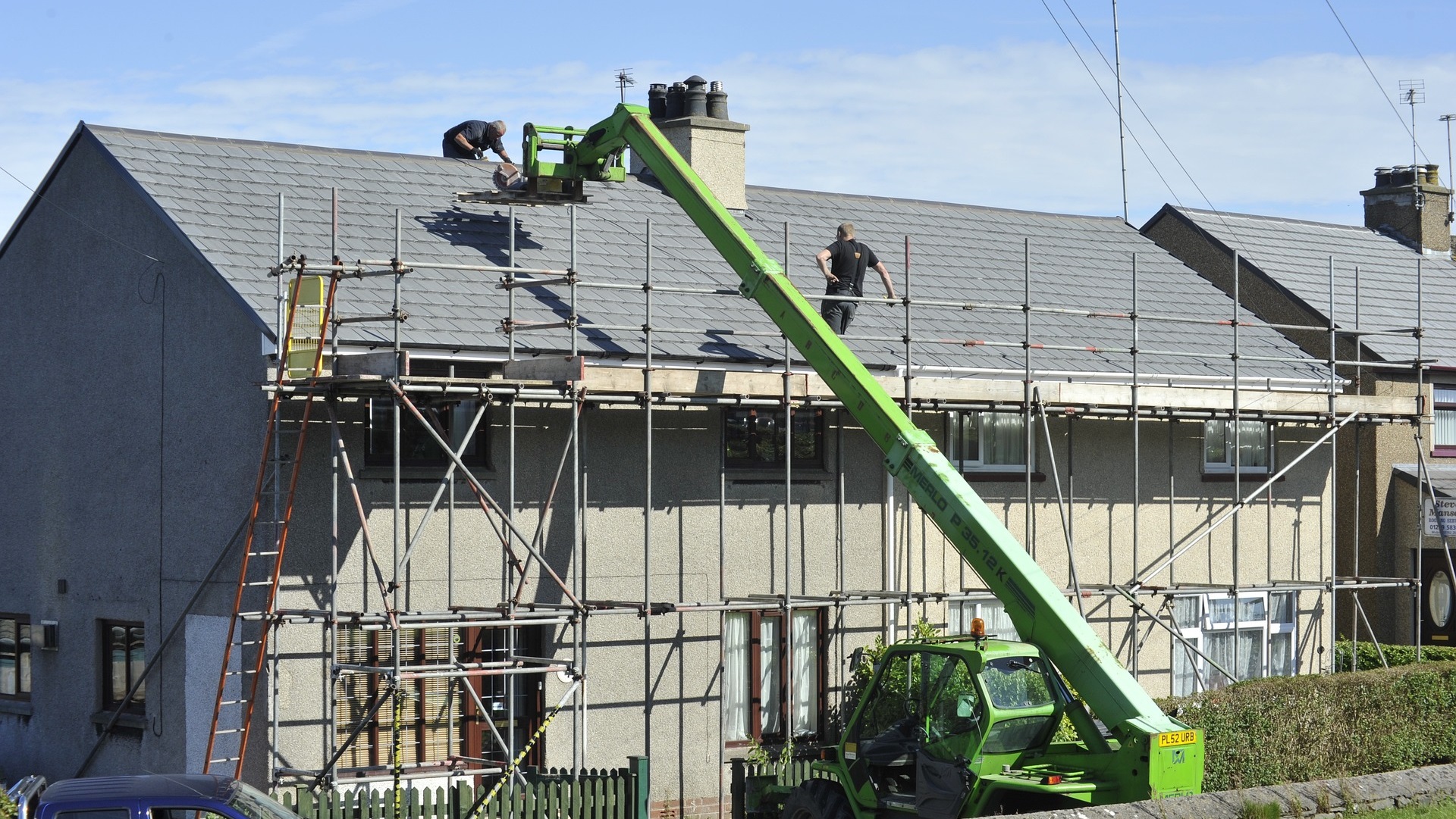 social homes being worked on with a crane