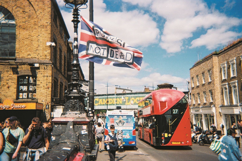 a flag reading punk's not dead in Camden, London