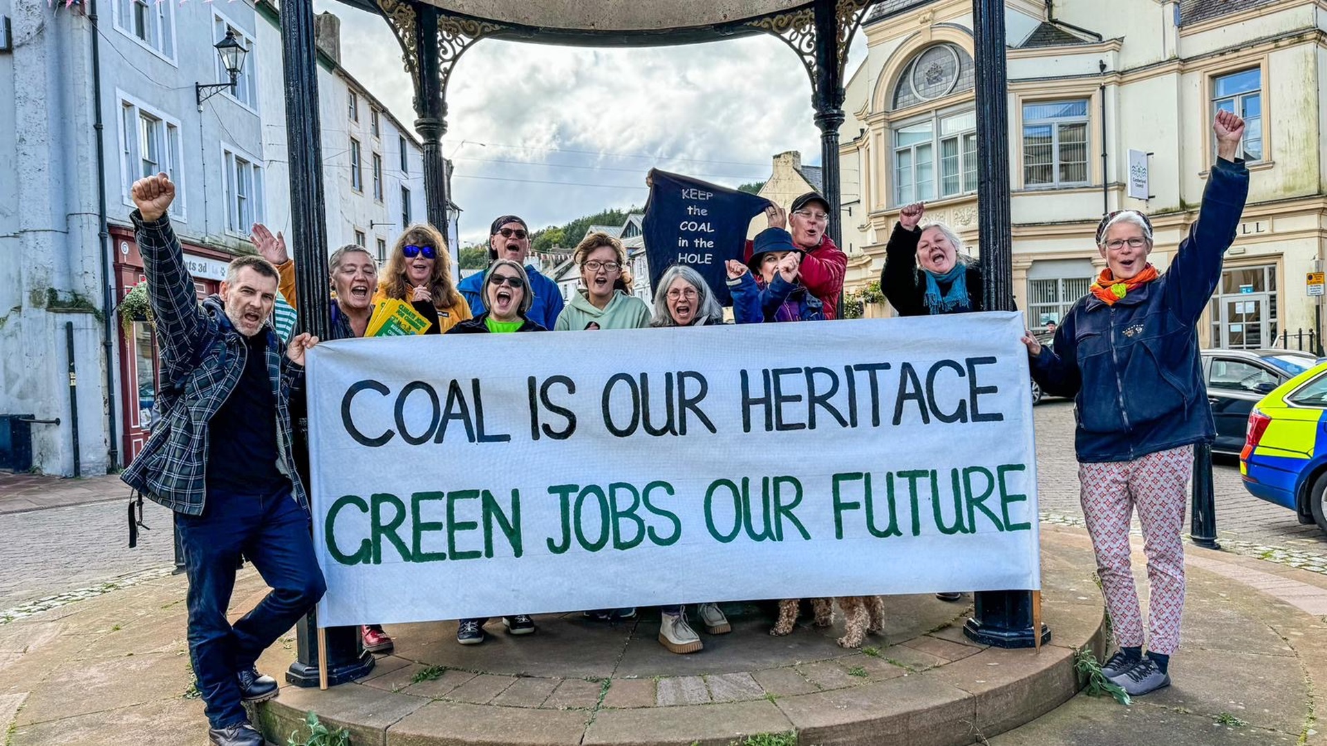 Members of South Lakes Action on Climate Change celebrate preventing a coal mine in Cumbria