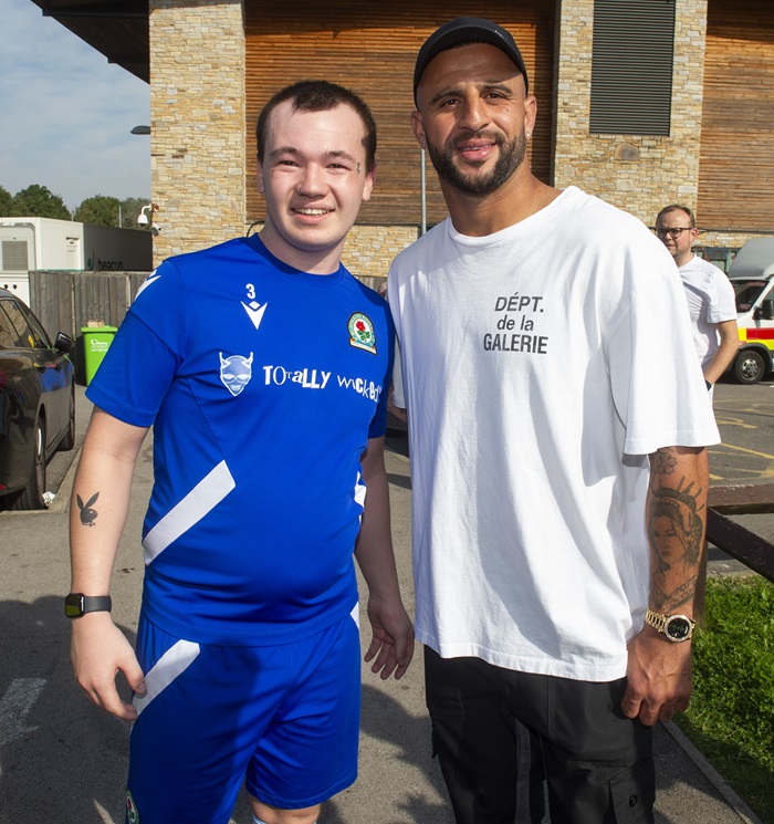 Salvation Army football player Isaac with Manchester City's Kyle Walker