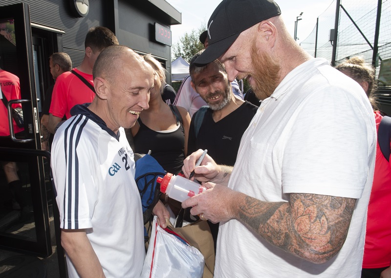 John Harton signs autograph at Salvation Army football tournament