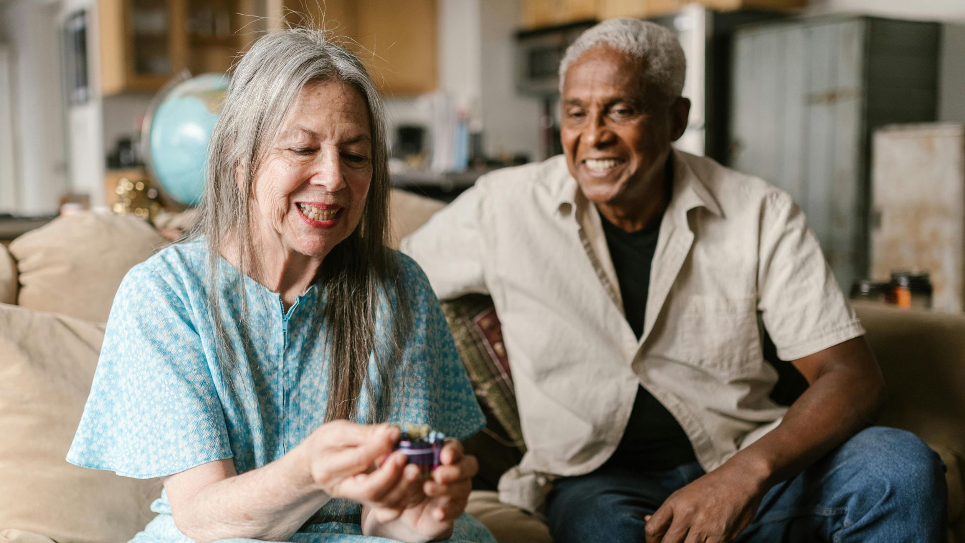 Stock image of two elderly people sitting on a sofa