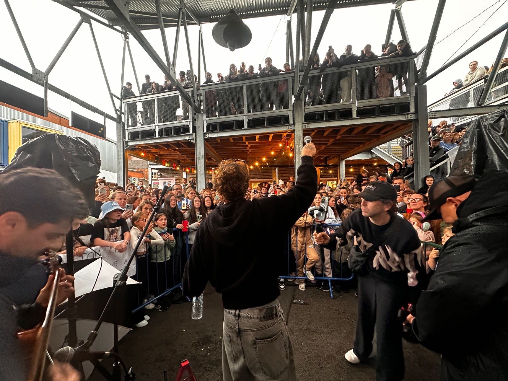 Tom Grennan in front of a crowd during a Big Issue busk in Coventry