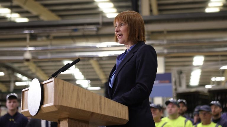 Chancellor of the Exchequer Rachel Reeves standing at a podium giving a speech