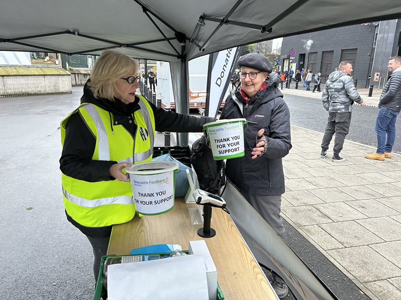 NUFC Fans Foodbank volunteer outside Newcastle United St James' Park stadium