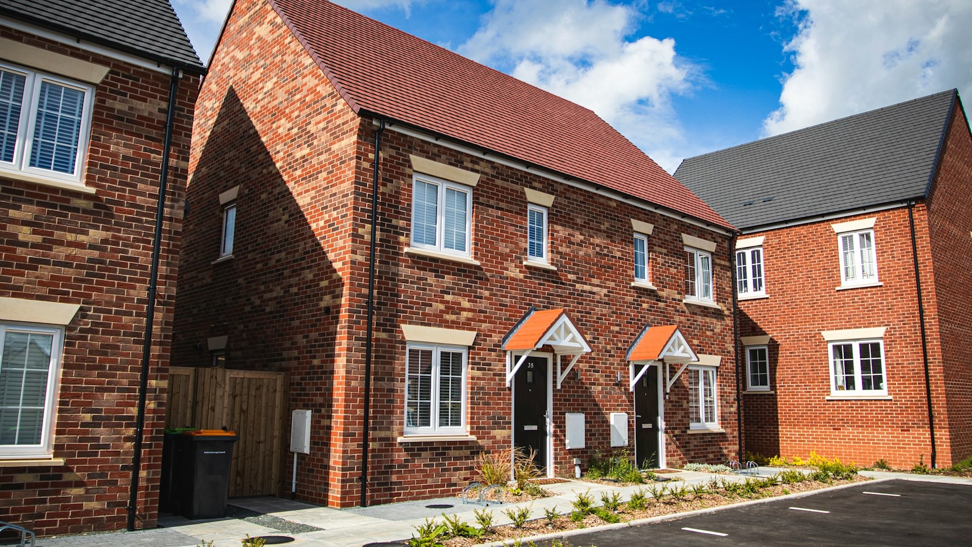 a red-bricked semi-detached house