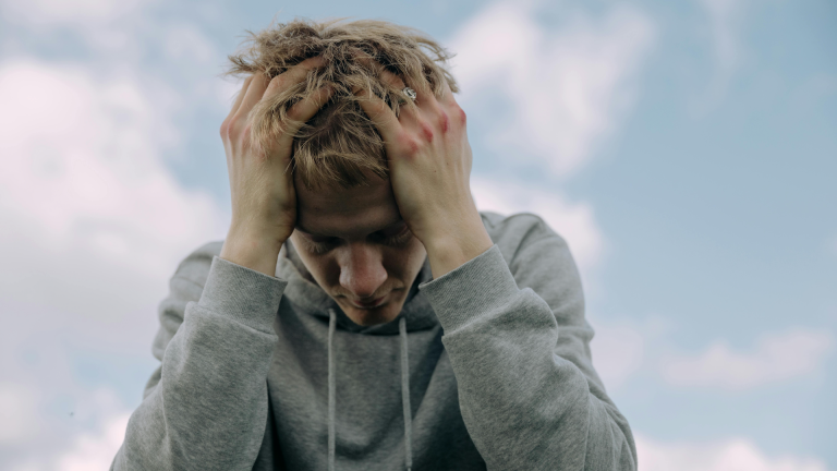 man with head in his hands