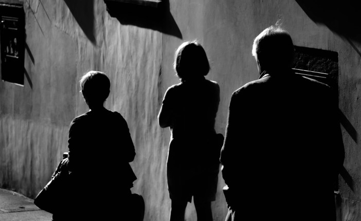 Silhouettes of three people