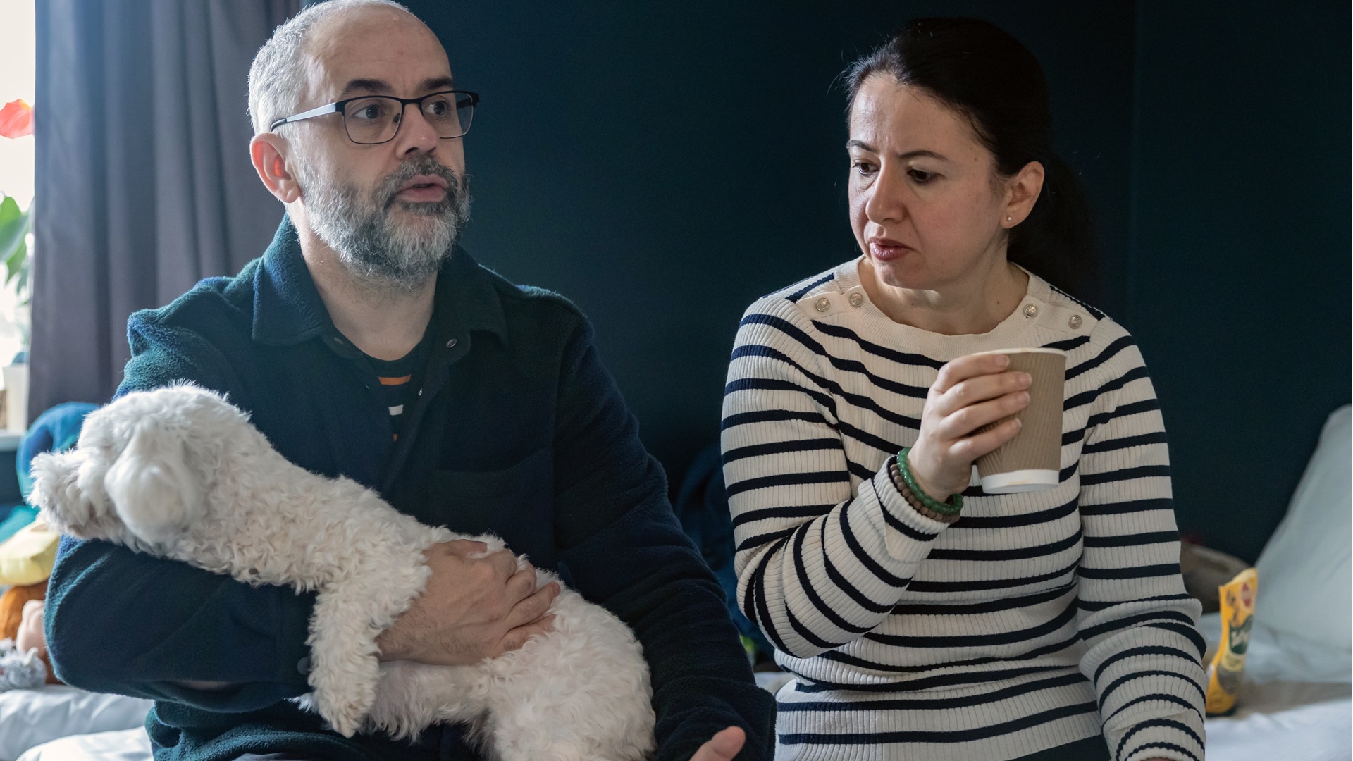 A couple in temporary accommodation with a dog