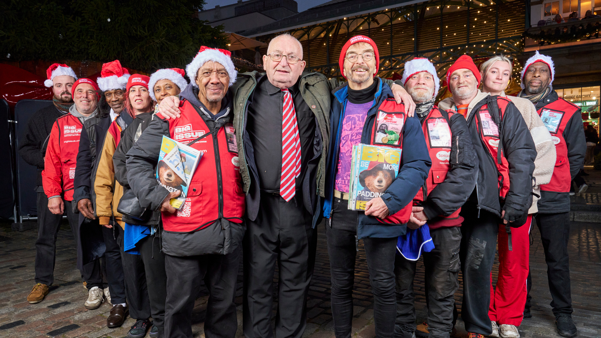 John Bird, Big Issue vendors and support workers gather to celebrate the launch of Big Issue's Christmas appeal