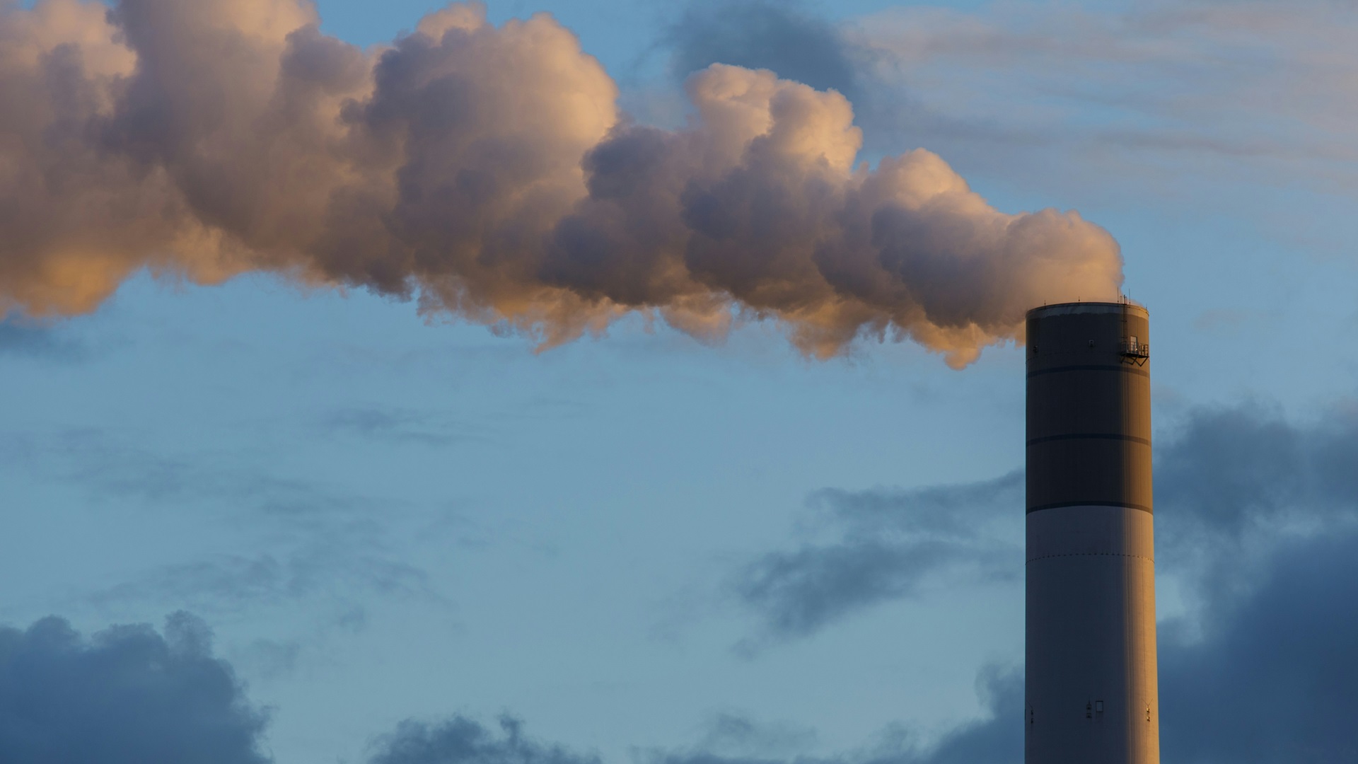 Polluting smoke coming out of a chimney