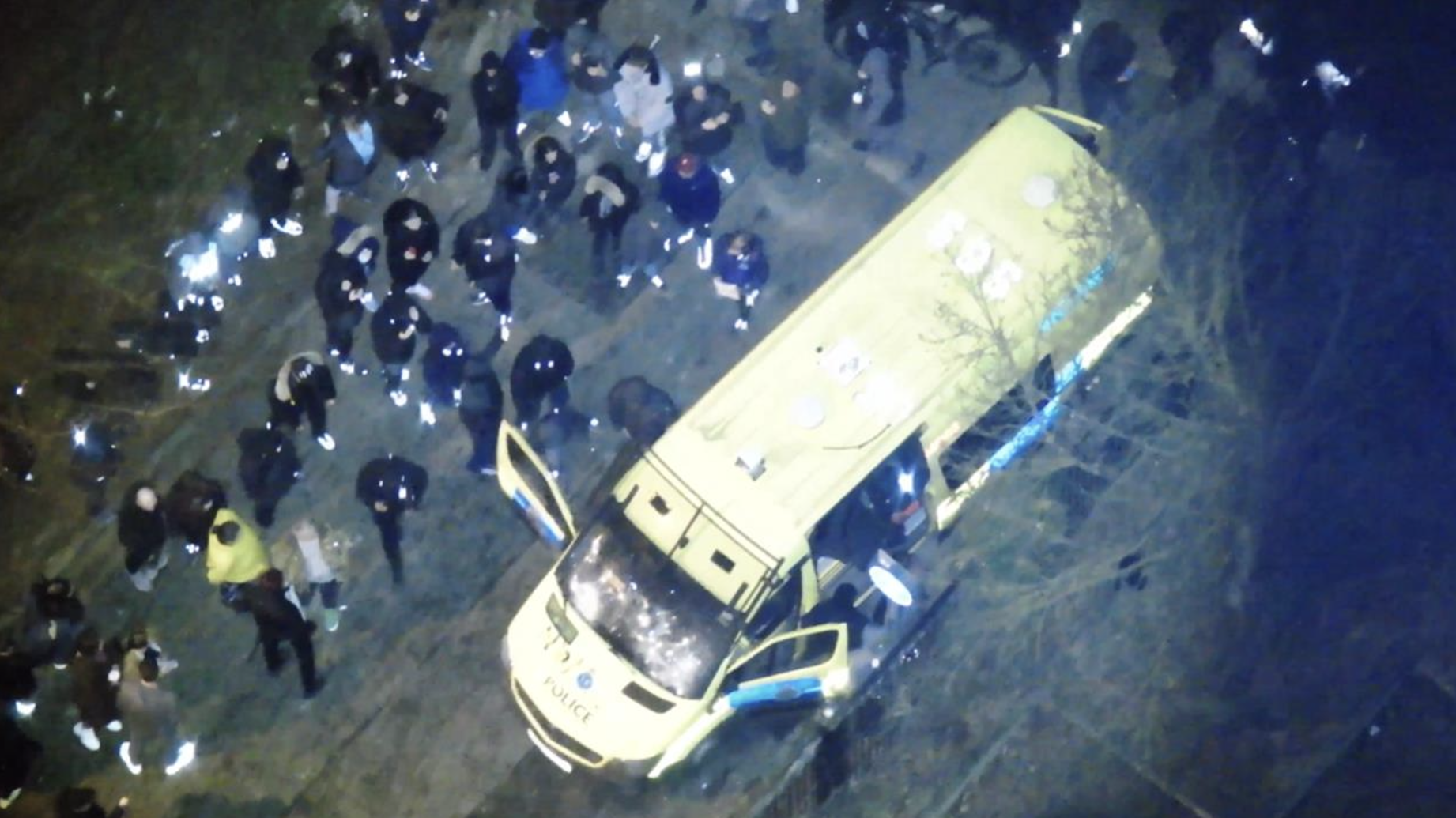 protesters surround a police van