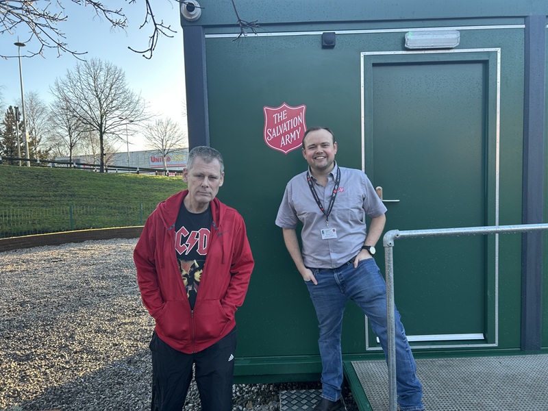 Two men from The Salvation Army outside the charity's homelessness accommodation