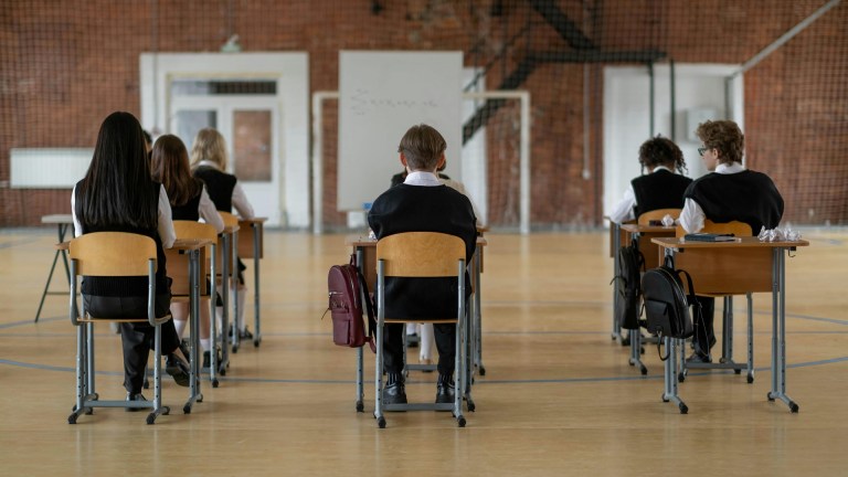 schoolchildren sat at desks