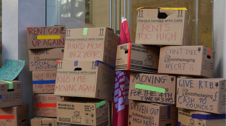 Cardboard boxes piled up at a London Renters Union protest