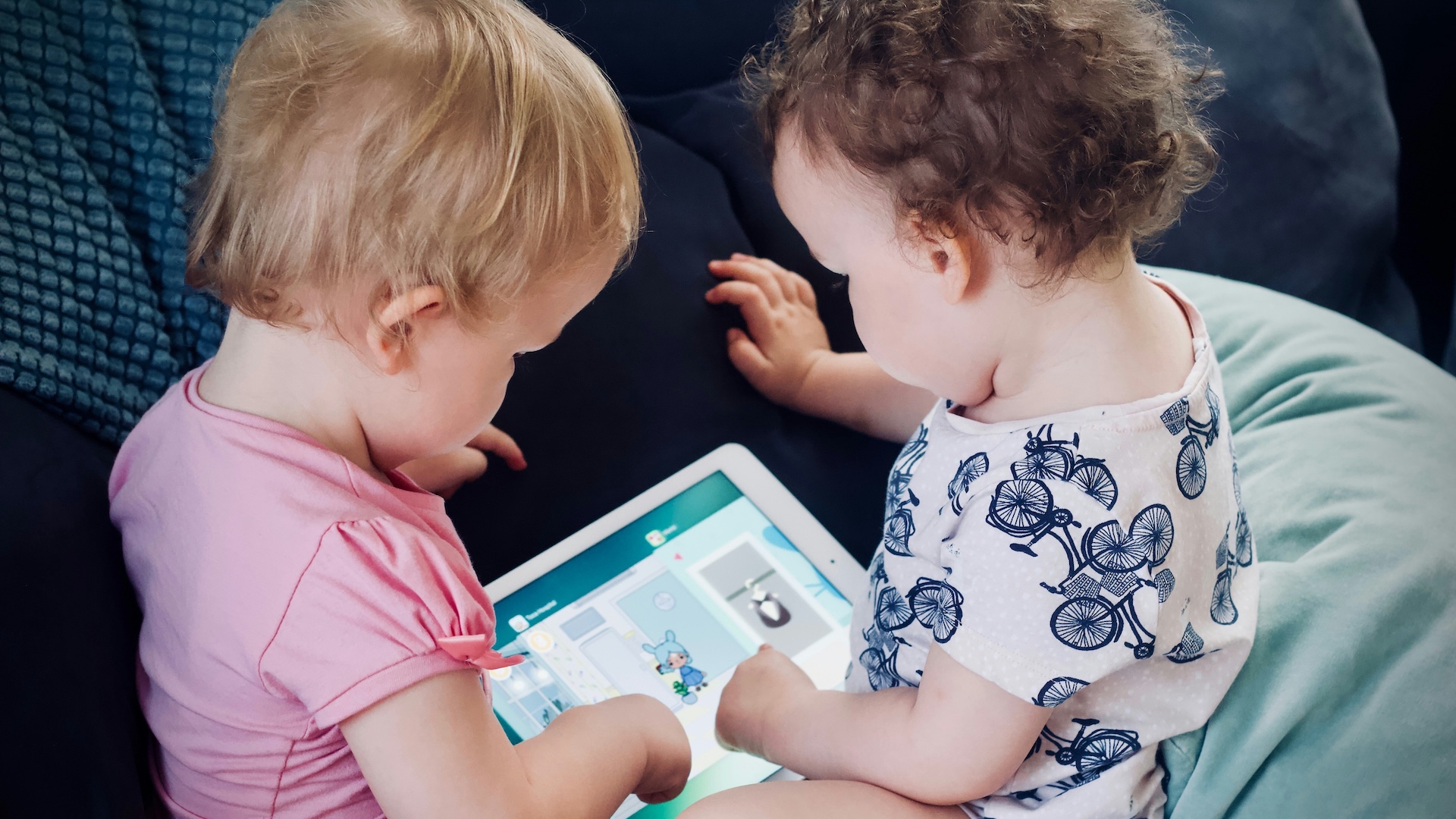 toddlers playing with ipad