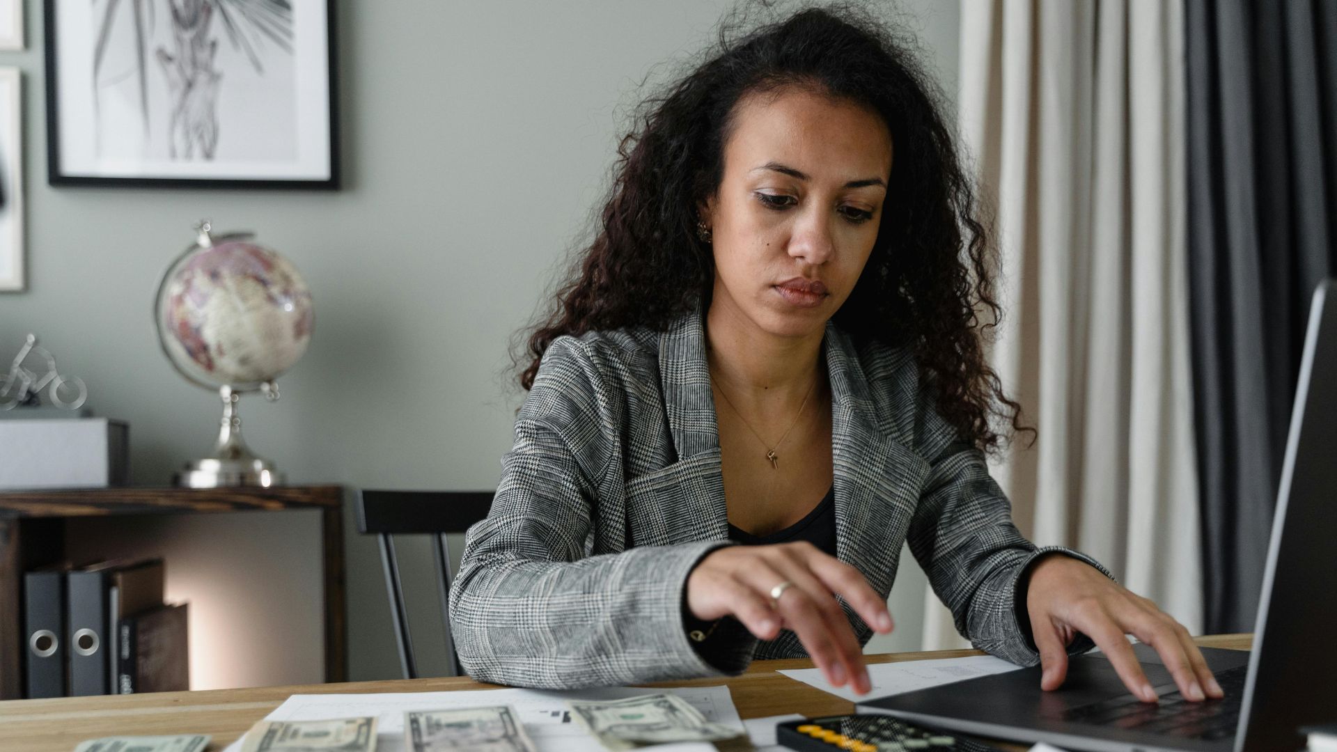 Person shown working at a laptop