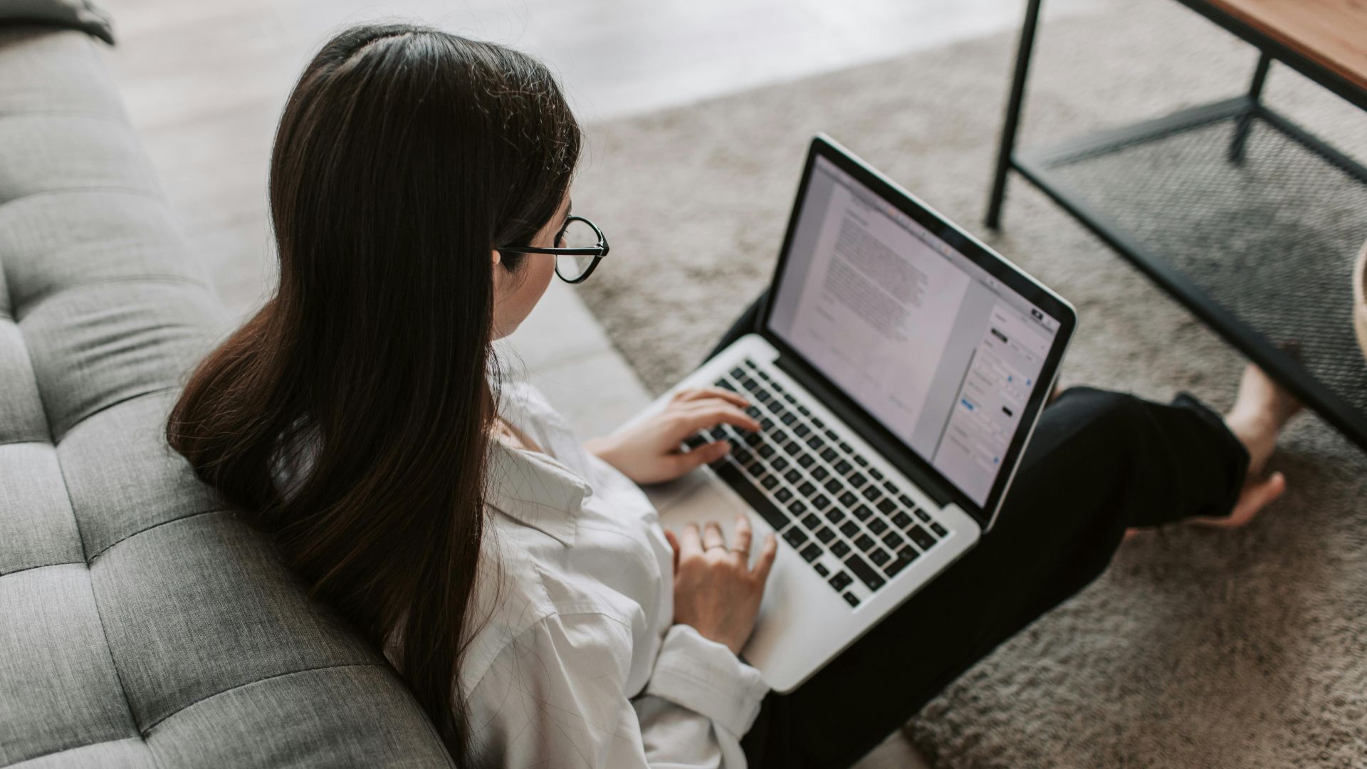 Stock image of a woman working on a laptop